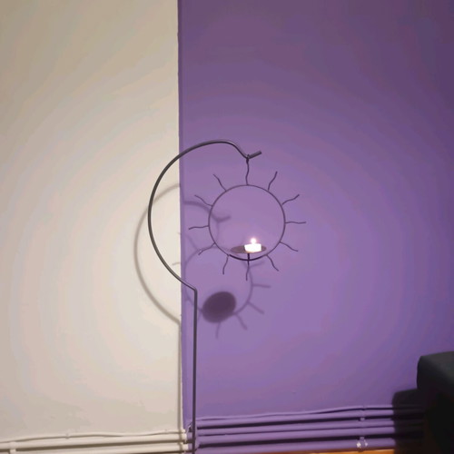 Handmade floor candlestick with hanging sun, like new, 1m height