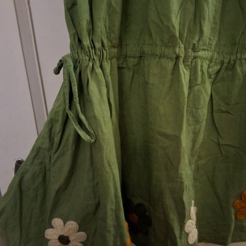Green dress used with embroidered flowers and elastic sleeves