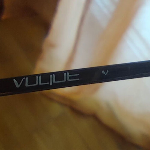 Vogue eyeglass frame used, gold color