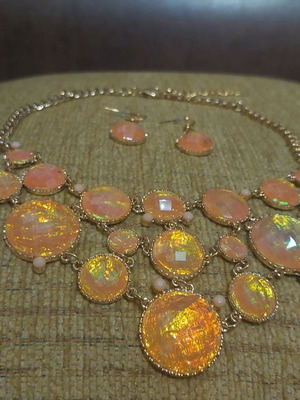 Necklace and earrings set new in orange gold