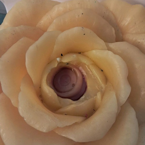 Large decorative rose candle used, yellow