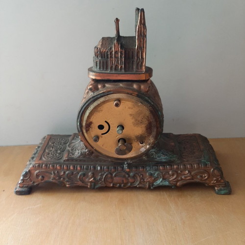 Copper German wind-up clock used with cathedral motif
