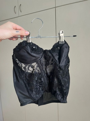Black lace corset top used with small defect