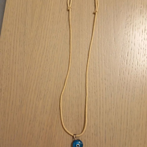Evil eye pendant with adjustable strap like new
