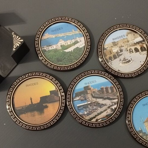 Vintage coaster set of 5 with original black holder from Rhodes
