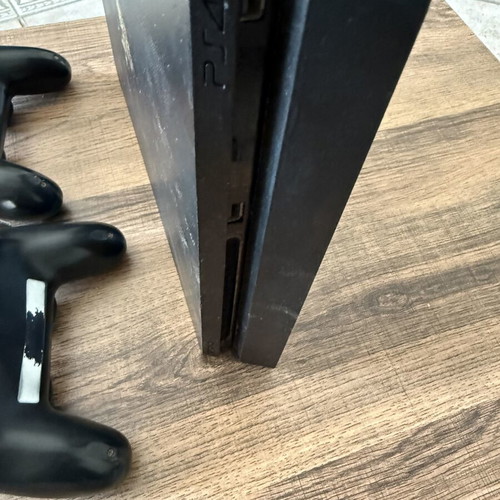 PlayStation 4 Slim 500GB used with 2 DualShock 4 controllers and accessories