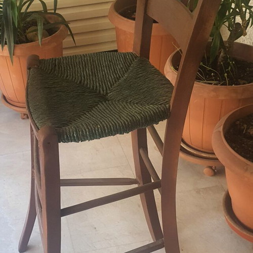 Wooden high chair with woven seat