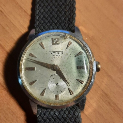 Two vintage wind-up watches and one bamboo watch used