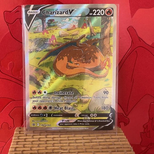 Charizard V card new in sleeve and album