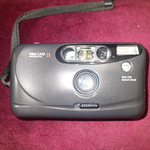 Mini Cam 35mm camera used with built-in flash