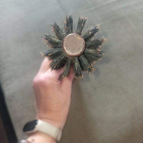 Round styling brush used, natural bristles