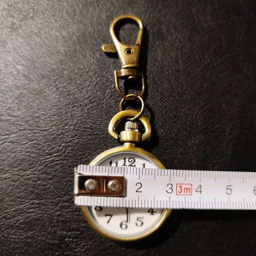 Quartz keychain watch like new, brass color, white dial