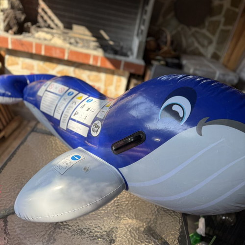 Inflatable dolphin float, blue, with side handles
