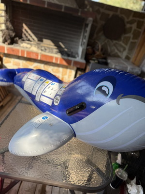 Inflatable dolphin float, blue, with side handles