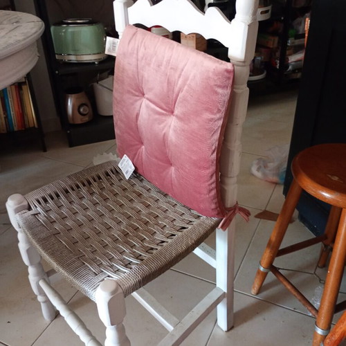 Vintage round dining table with 3 wooden chairs and rattan seats