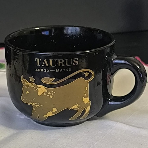 Zodiac Taurus mug like new, ceramic with black glaze and gold design