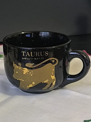 Zodiac Taurus mug like new, ceramic with black glaze and gold design