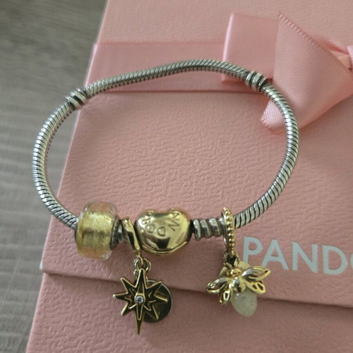 Pandora authentic bracelet like new with 3 gift charms silver and gold