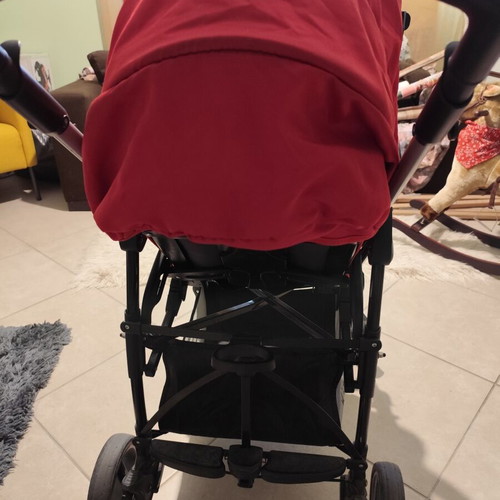 Kiddo Smart Deluxe stroller used with footmuff and changing bag, red