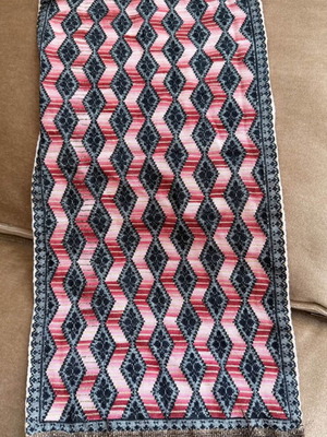 Handmade embroidered table runner with diamond pattern