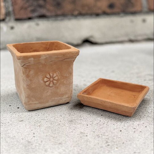 Square ceramic pot new from high-quality clay with saucer