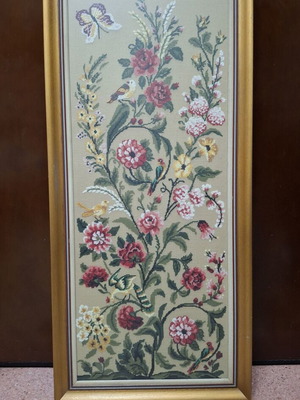 Vintage handmade embroidery frame with flowers and butterflies