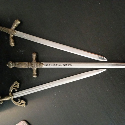 Decorative stand with sword letter openers used