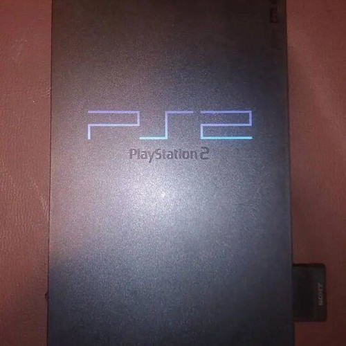 PlayStation 2 fat console with two games