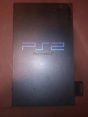 PlayStation 2 fat console with two games