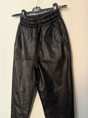 Women's black leather balloon or jogger pants used, with elastic waist and cuffs