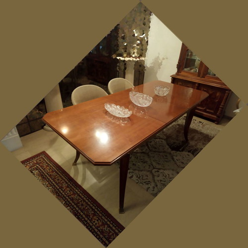 Wooden rectangular dining table used with extension leaf for 6-8 people