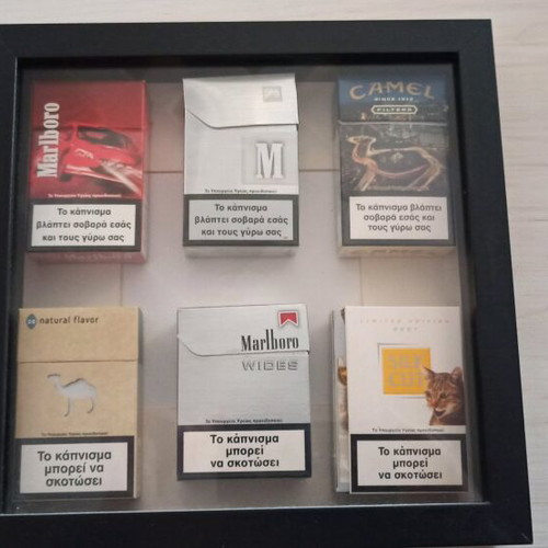 Frame with used collectible cigarette packs