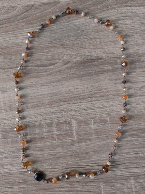 Handmade necklace with gold-plated wire and crystals in beige brown shades