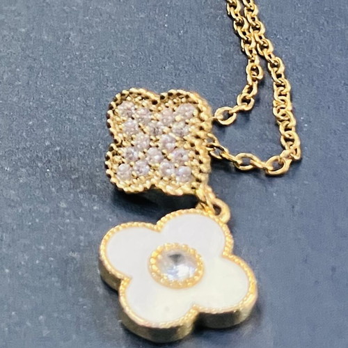 Necklace new with white enamel flower