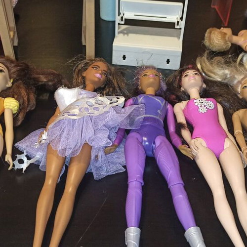 Barbie and other toys used, in moderate condition