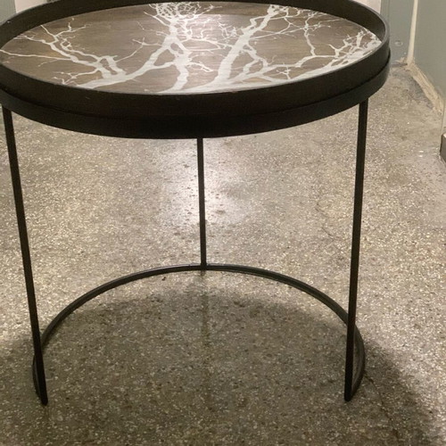 Decorative coffee table used with metal base and wooden top frame