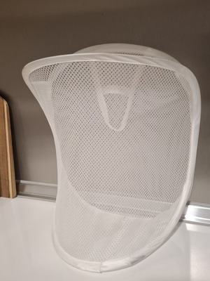 Foldable mesh storage basket white used for laundry and toys