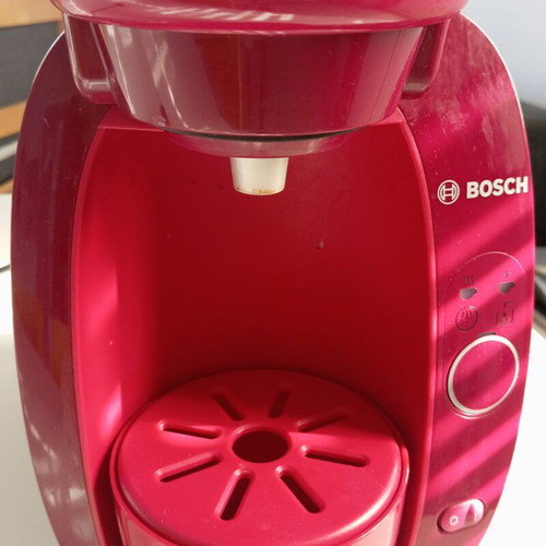 Tassimo Bosch coffee machine used, bordeaux color with descaling capsule