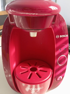 Tassimo Bosch coffee machine used, bordeaux color with descaling capsule