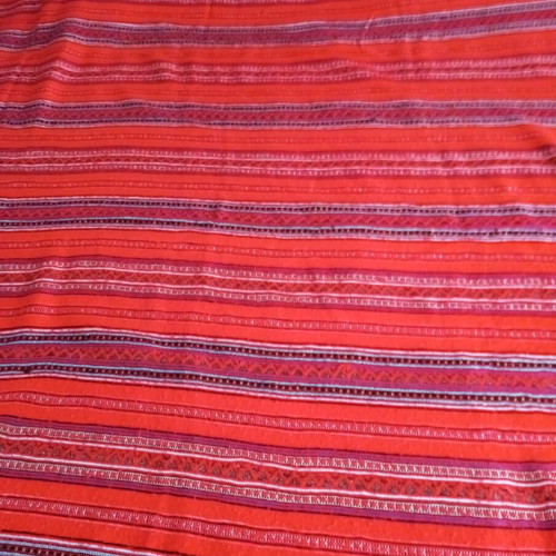 Woven blanket cover used, striped wool