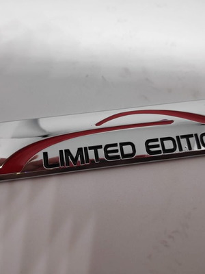 Limited Edition Metal Car Badge like new, silver chrome with red detail