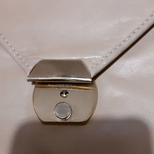 Handbag beige genuine leather used with metal details and lock