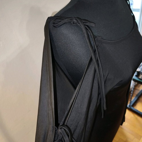 Black asymmetric top like new with ties and semi-transparent sleeves size M