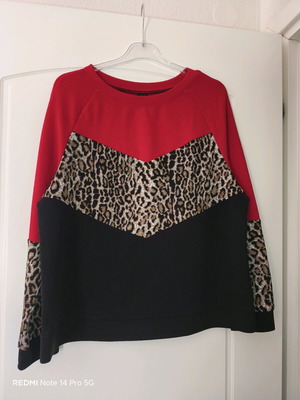Shein blouse with animal print and black details like new