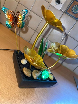 Indoor fountain with LED lighting and stones