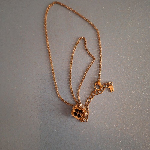 Folli Follie necklace like new, gold color with barrel and stones