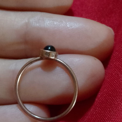 Ring with black stone in copper color, like new, inner diameter 16