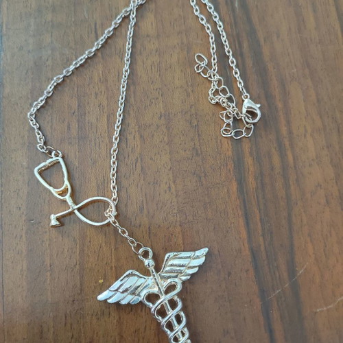 Health symbol necklace used, unworn