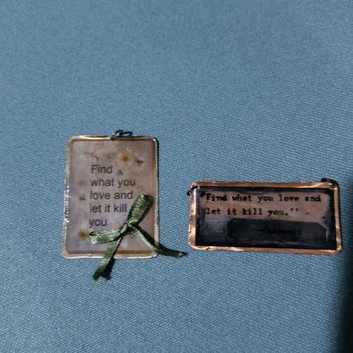Pendant with Bokowski quotes like new, brown and green