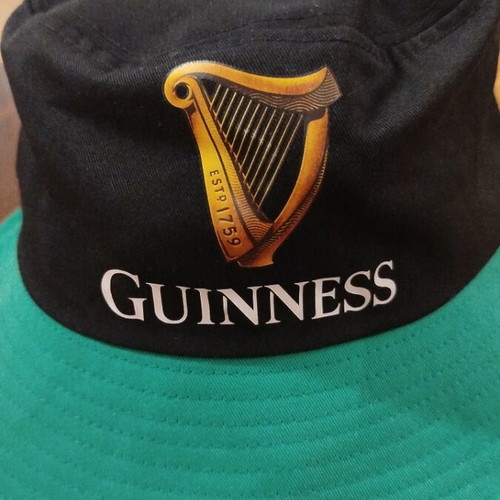 Guinness Bucket Hat new, black with green brim, one size